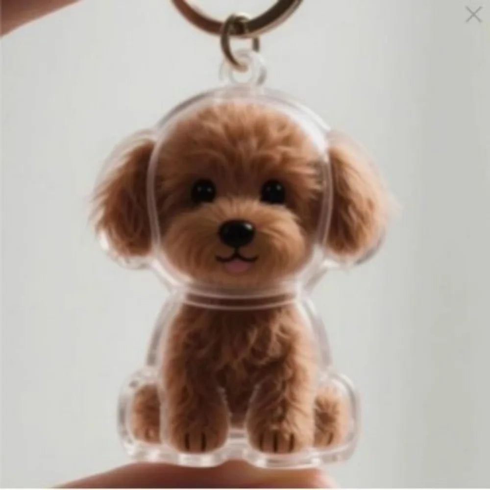 Transparent pet hair memorial keychain capsule with fluffy brown puppy figurine