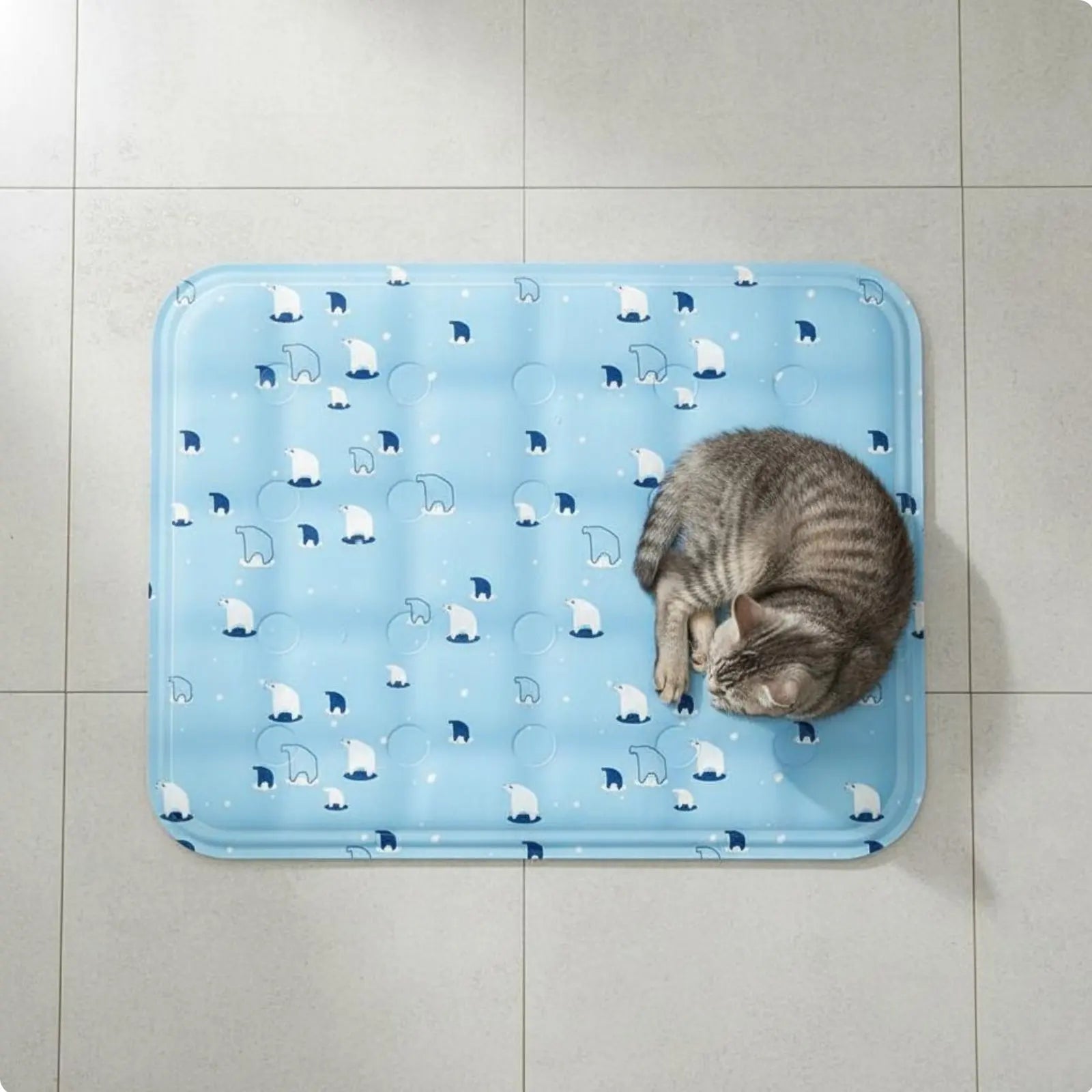 Light blue cooling gel mat for pets with polar bear pattern and a cat curled up