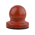 Single orange-brown pet nail grooming tool with black abrasive base