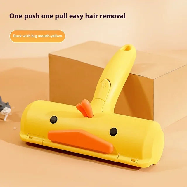 Yellow duck-style pet hair roller brush with orange bar and side buttons
