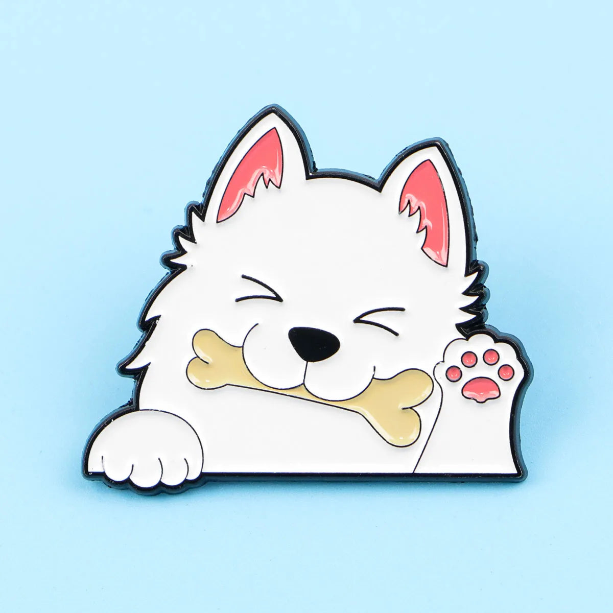 White dog enamel lapel pin lying down with bone and pink paw-print detail