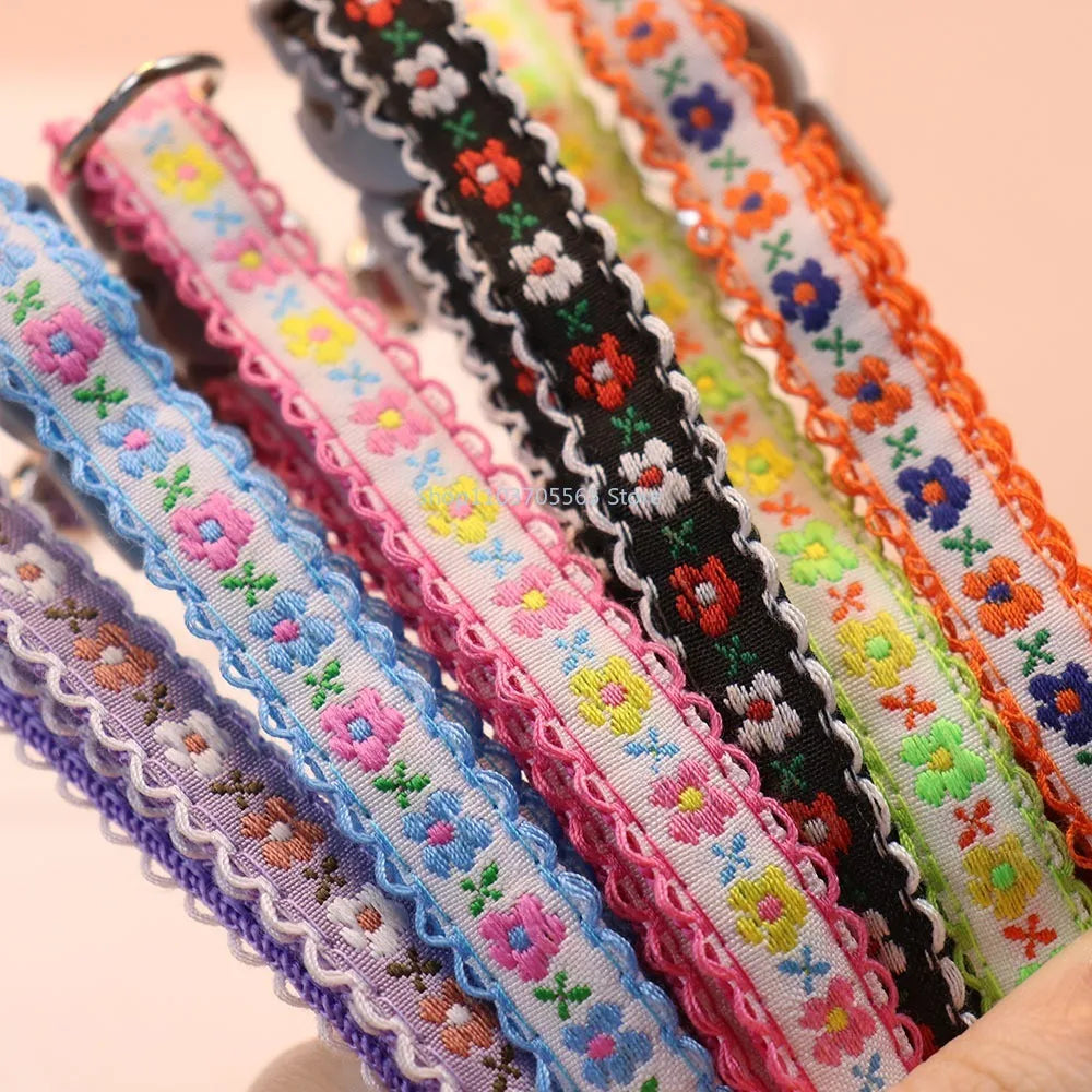 Floral embroidered lace cat collar straps, multicolor stitched flowers with scalloped edge.