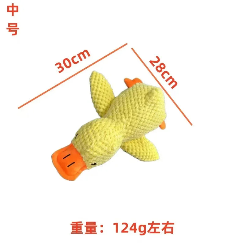 Light yellow textured plush fish chew toy with orange fins and rounded belly