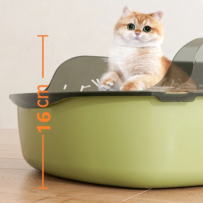Semi-enclosed cat litter box with scoop, greenish-gray body and open entry