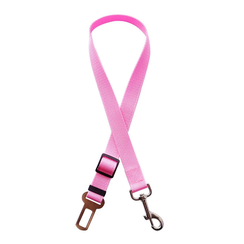 Adjustable pet car safety harness clip belt, pink strap with buckle and metal carabiner clip.
