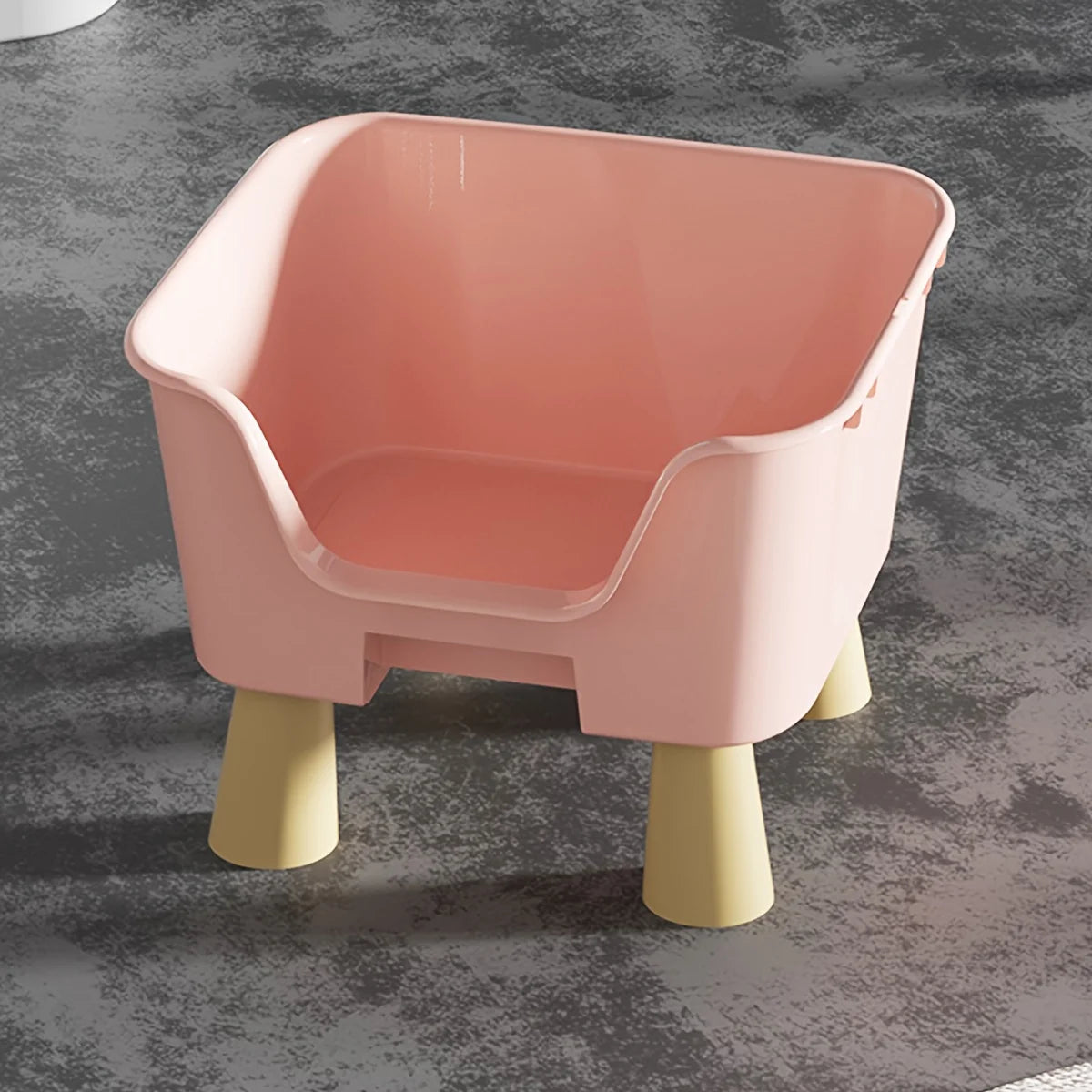 Pink cat bed with raised legs and curved front opening, smooth molded sides.