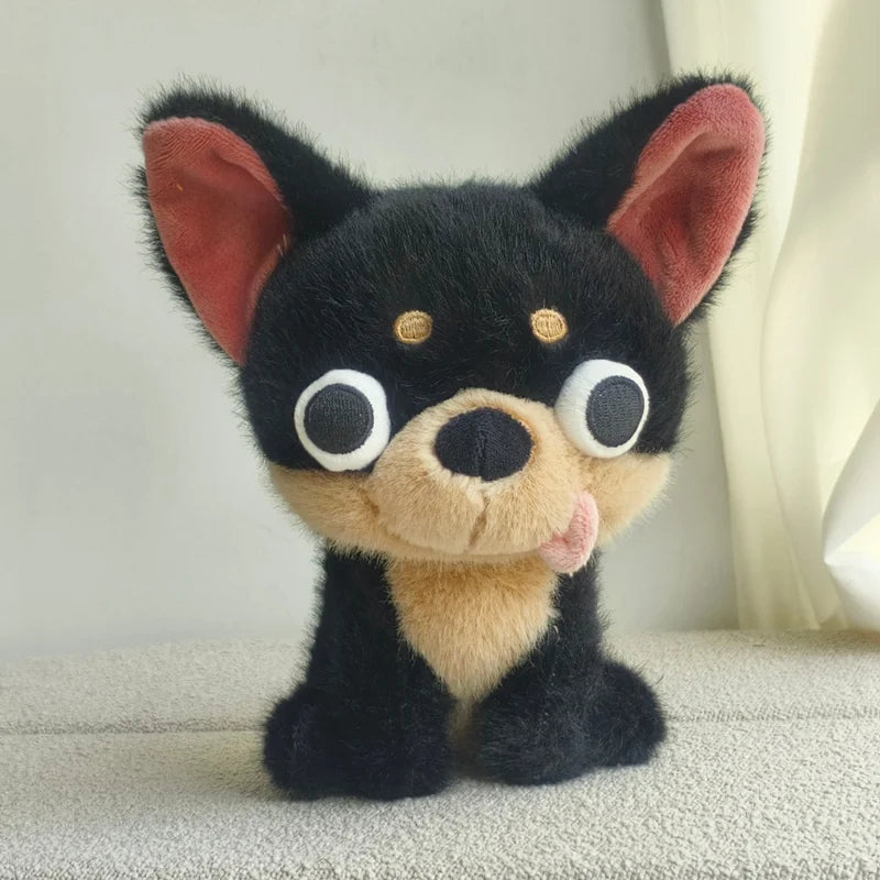 Black Chihuahua plush toy with tan muzzle, round eyes, and soft fabric texture