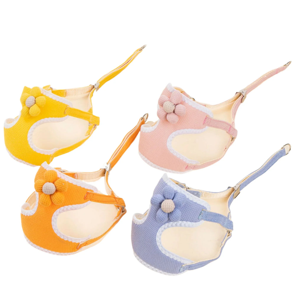 Dog harness and leash set in four colors—yellow, orange, pink, and blue—with paw charms