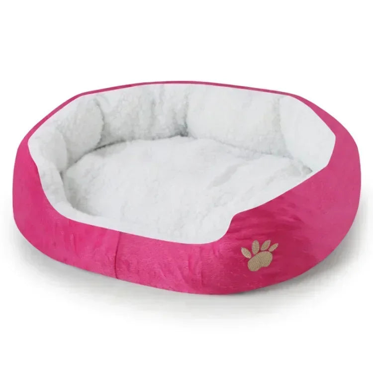 Plush oval dog bed sofa lounger, rose-pink with inner white cushion and paw logo