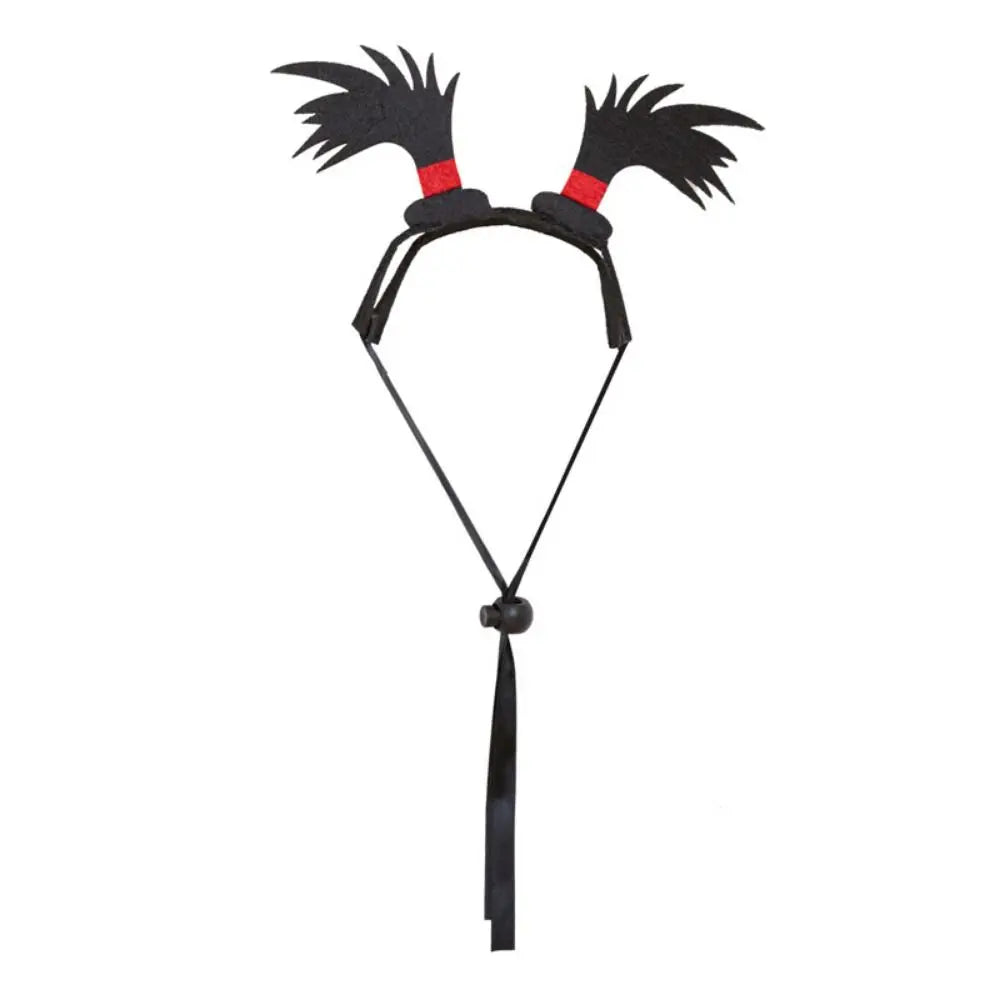 Black pet headband with red-topped spiky horns and long dangling tassel
