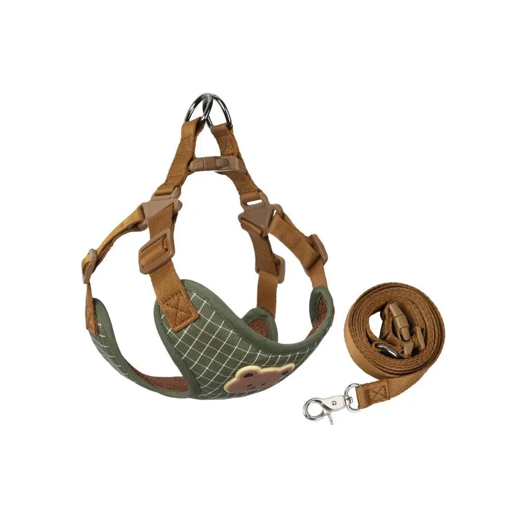 Plaid green dog harness with brown straps and matching leash, folded for viewing