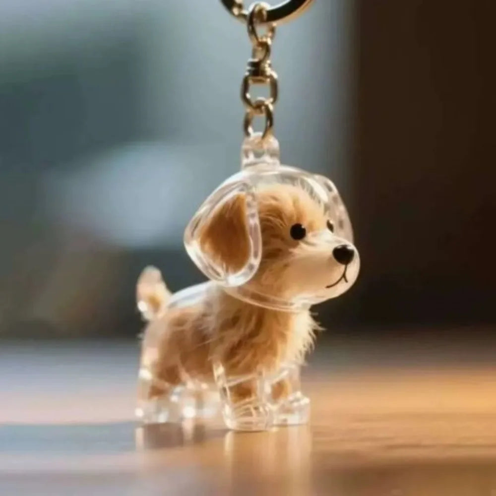 Transparent pet hair memorial keychain capsule with golden retriever dog figurine