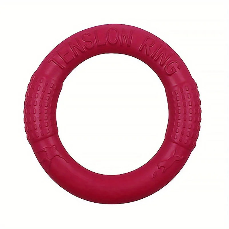 Red rubber dog rally ring with embossed lettering, circular training toy