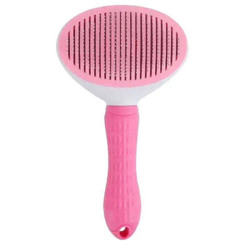 Pet hair remover brush in pink with round needle comb head and textured handle.