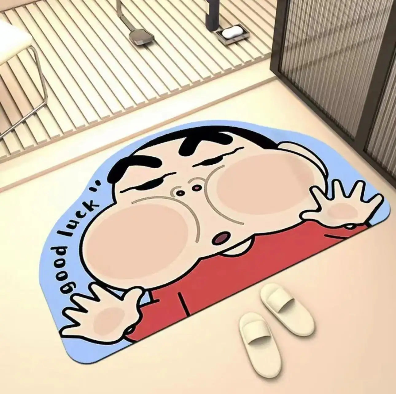 Quick-drying cartoon bath mat with a character stretching, red body and blue border
