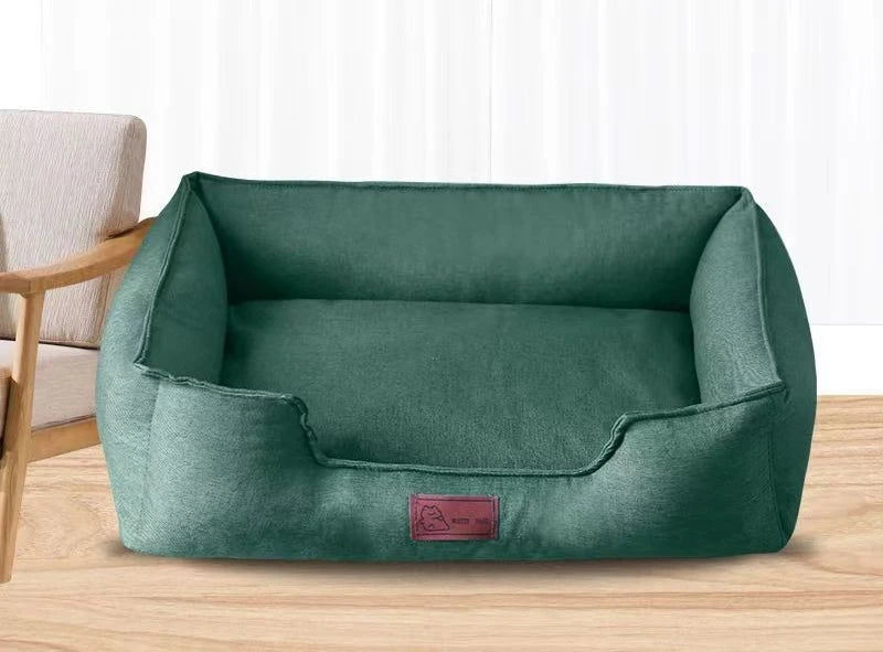 Green pet mattress with padded walls and a removable-looking inner cushion