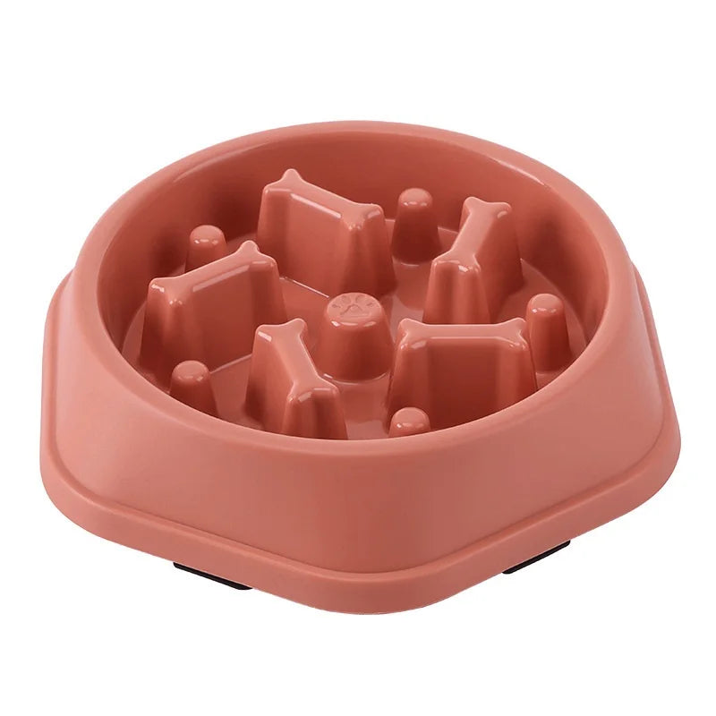 Red-pink slow feeder dog bowl with raised maze-like insert