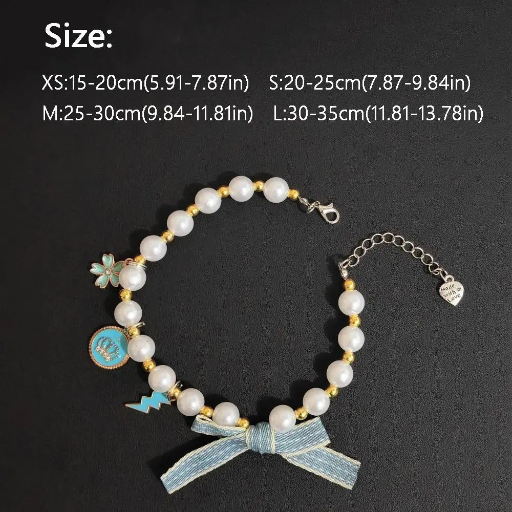 Cat pearl necklace collar with blue ribbon bow and round charm medallion, size shown