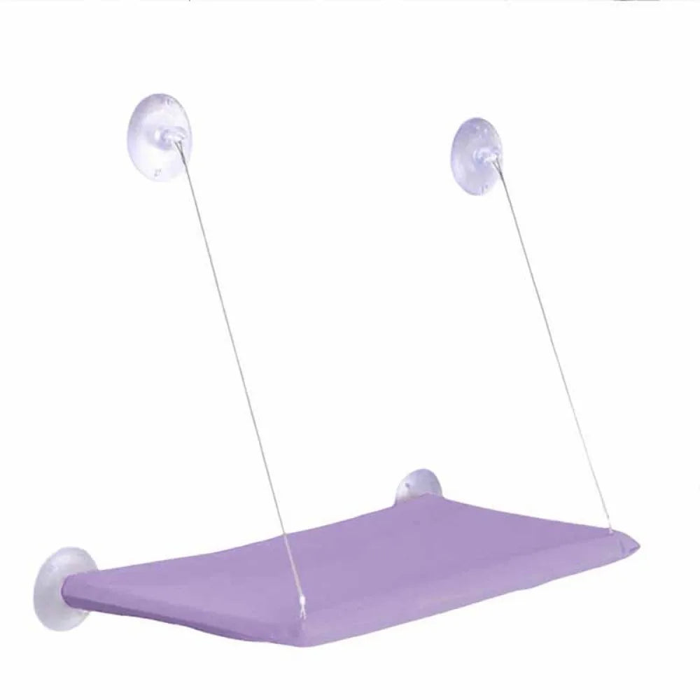 Hanging cat hammock bed with purple fabric seat and four suction-cup attachment points