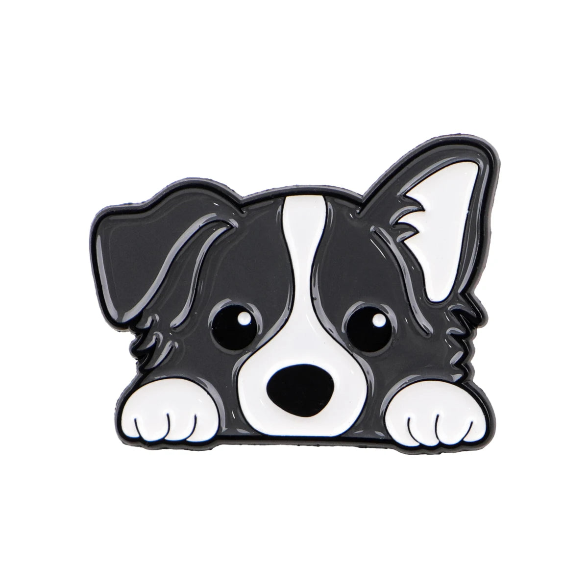 Black-and-white dog enamel lapel pin, lying with large eyes visible