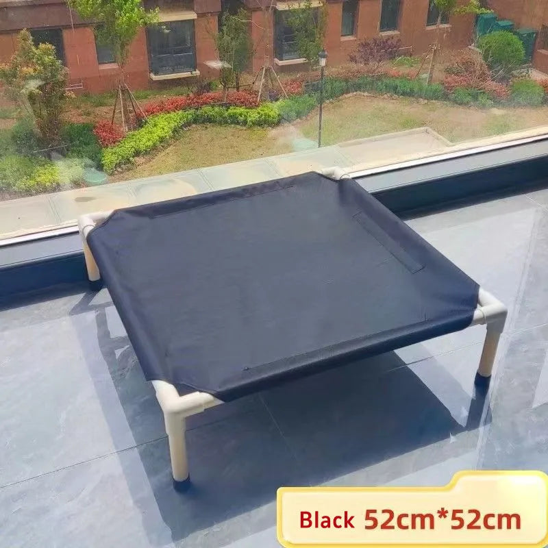 Black foldable pet hammock bed with white legs and taut fabric top