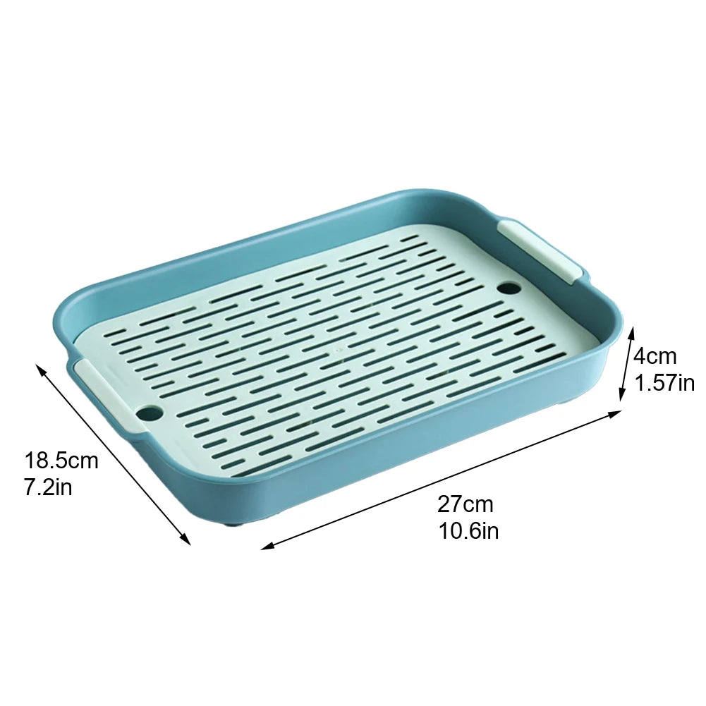 Small pet litter box with teal base and vented light-gray insert grate, compact size