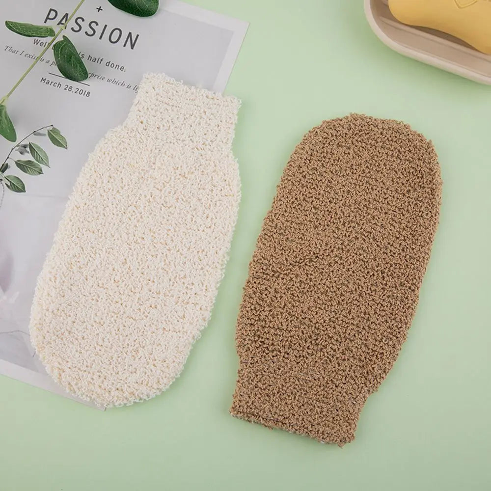 Exfoliating bath scrub mitts in white and tan with coarse looped texture.
