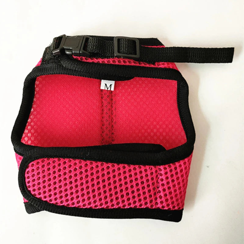 Red and pink mesh harness, black trim, and metal D-ring, size label visible.