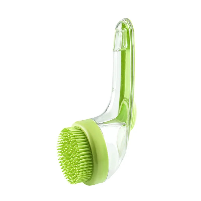 Green silicone pet grooming brush with raised tip pad and curved clear handle