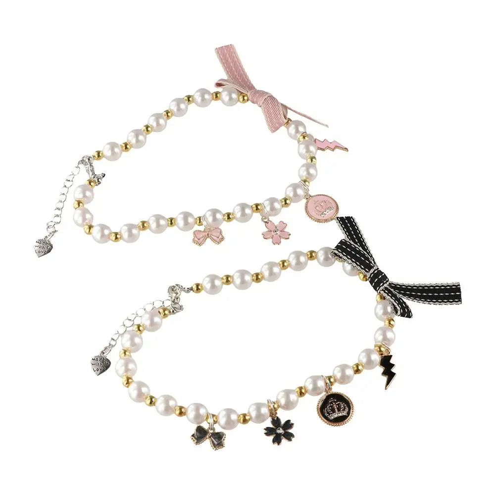 Cat pearl necklace collar with pink ribbon bow and dangling charm pendants