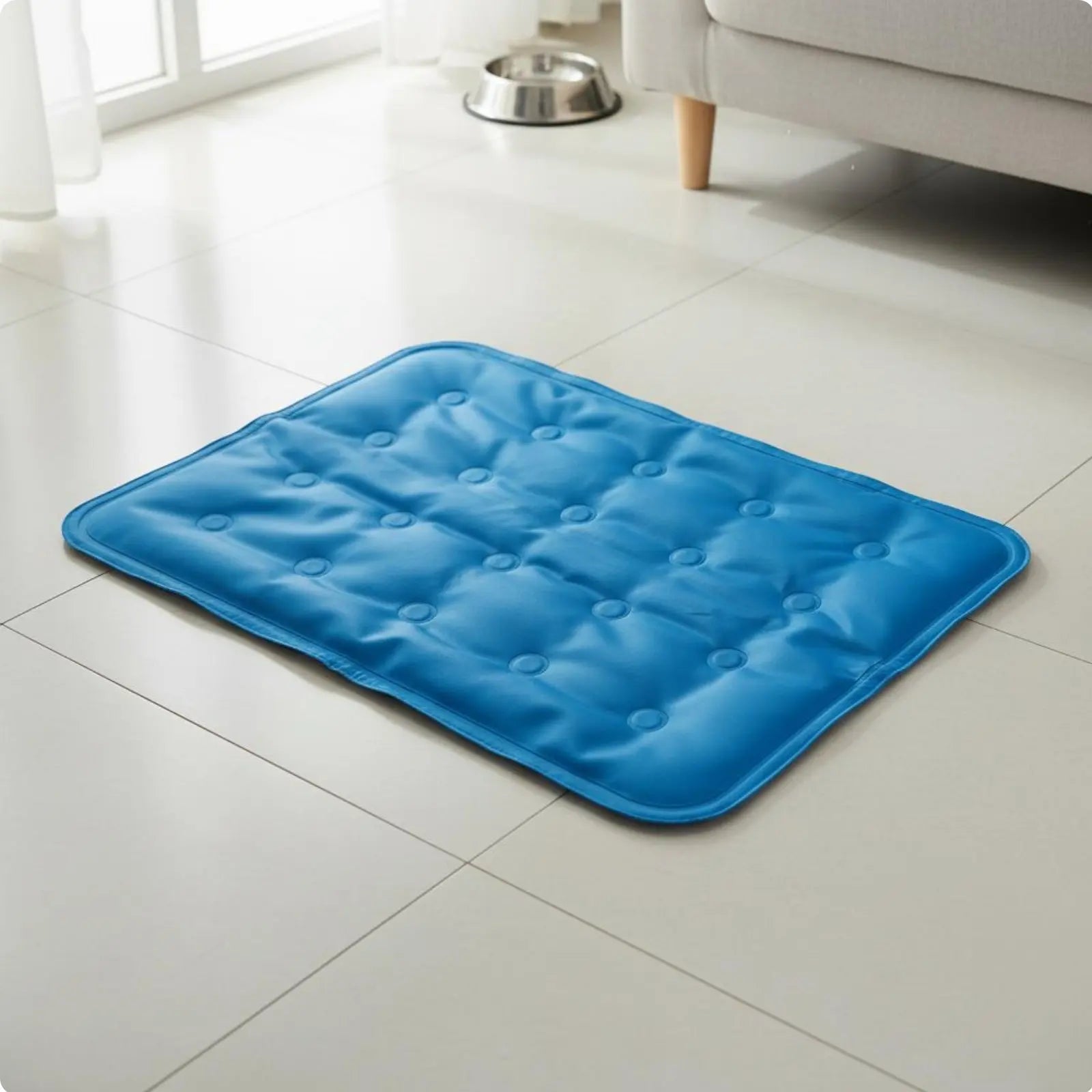 Blue cooling gel mat for pets laid flat on a light tile floor