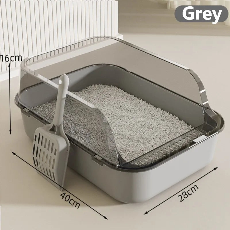 Grey semi-enclosed cat litter box with scoop, textured base and curved hood