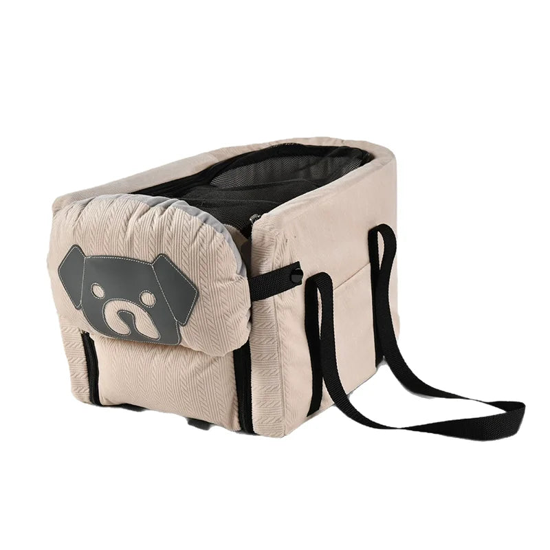 Pet carrier backpack bag in beige/cream with black trim and dog face patch front.