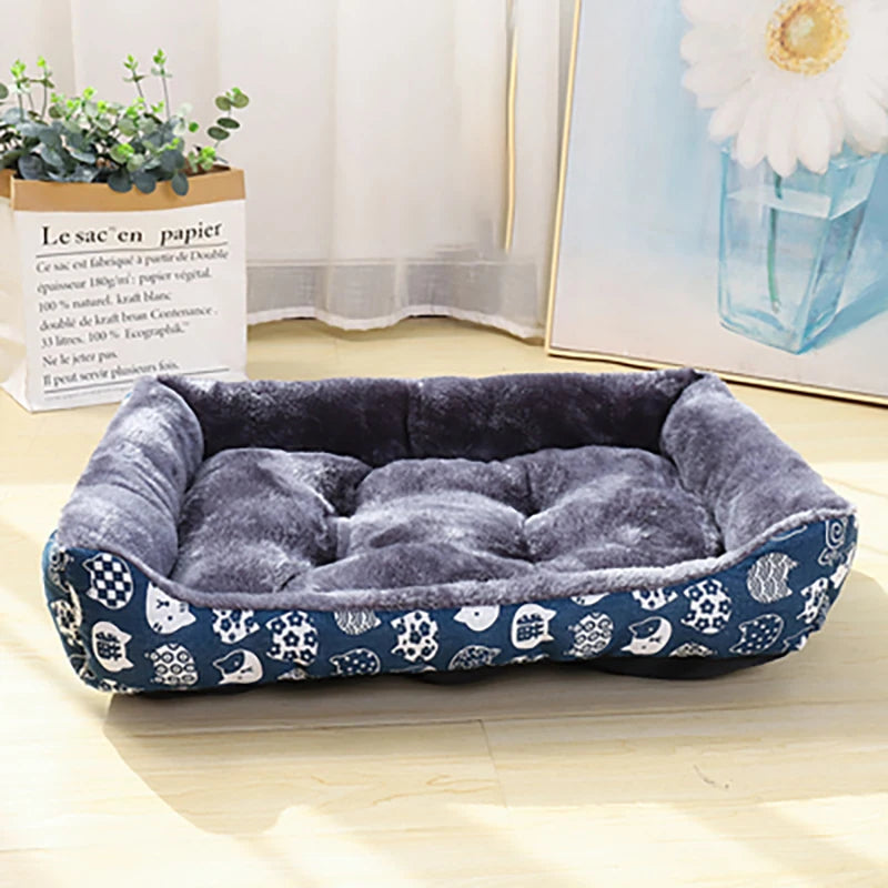 Dark gray plush dog sofa bed mat with blue patterned outer cushion