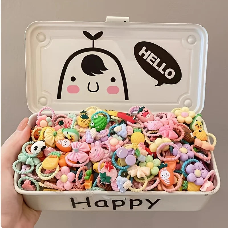Assorted flower and bow pet hair accessories in a white Hello Happy case