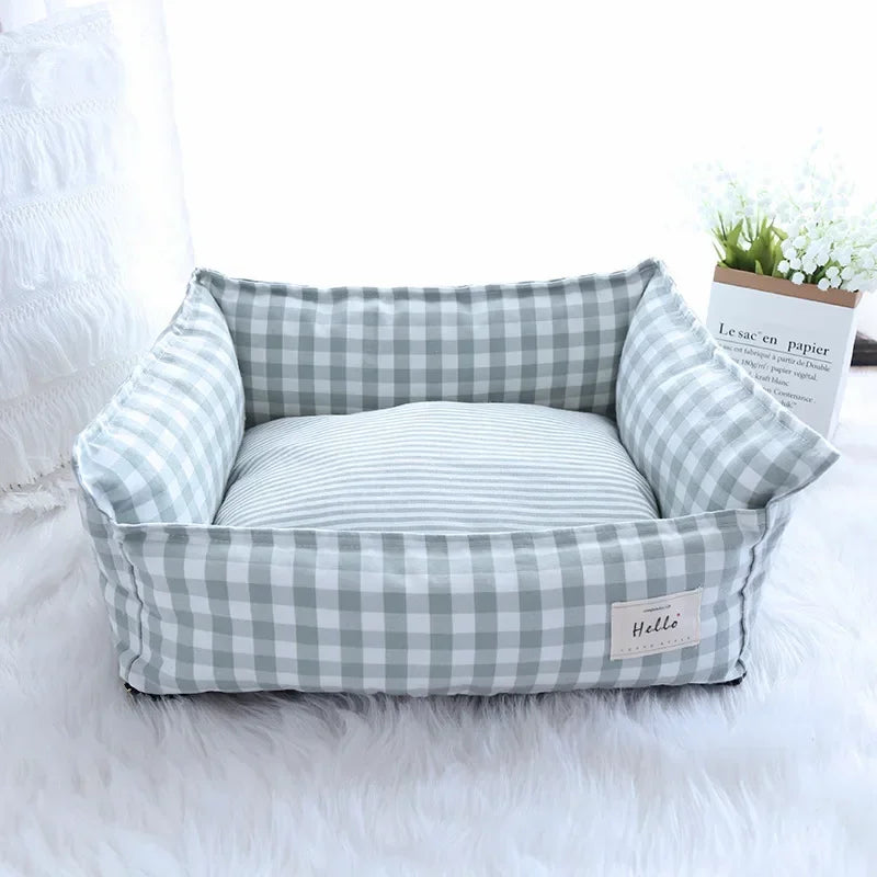 Light gray and white checkered pet sofa bed with striped inner cushion