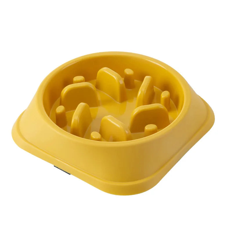 Yellow slow-feeding non-slip pet bowl with raised anti-choke maze insert