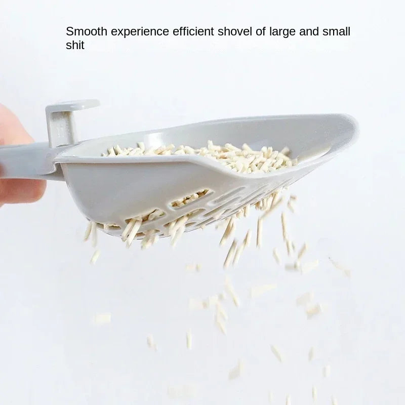 Gray cat litter scoop with long handle; perforated tray shows collected litter