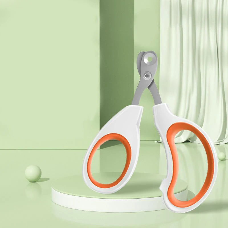 Pet nail trimming scissors with circular safety hole, white handles and orange rings