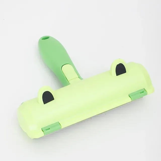 Lime green pet hair roller brush with black gripping pads and wide sweeping base