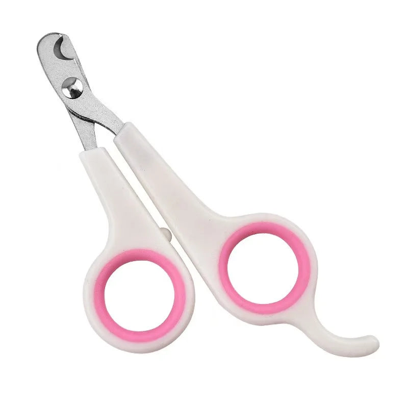 Pink pet nail trimming scissors with white body, silver blades, and loop handles.