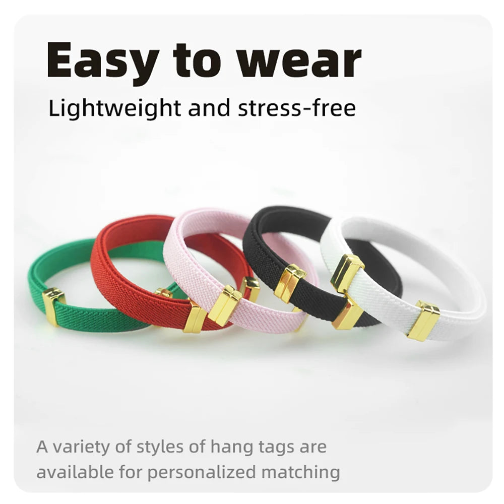 Assorted color breakaway cat collars with round AirTag holders and gold buckles