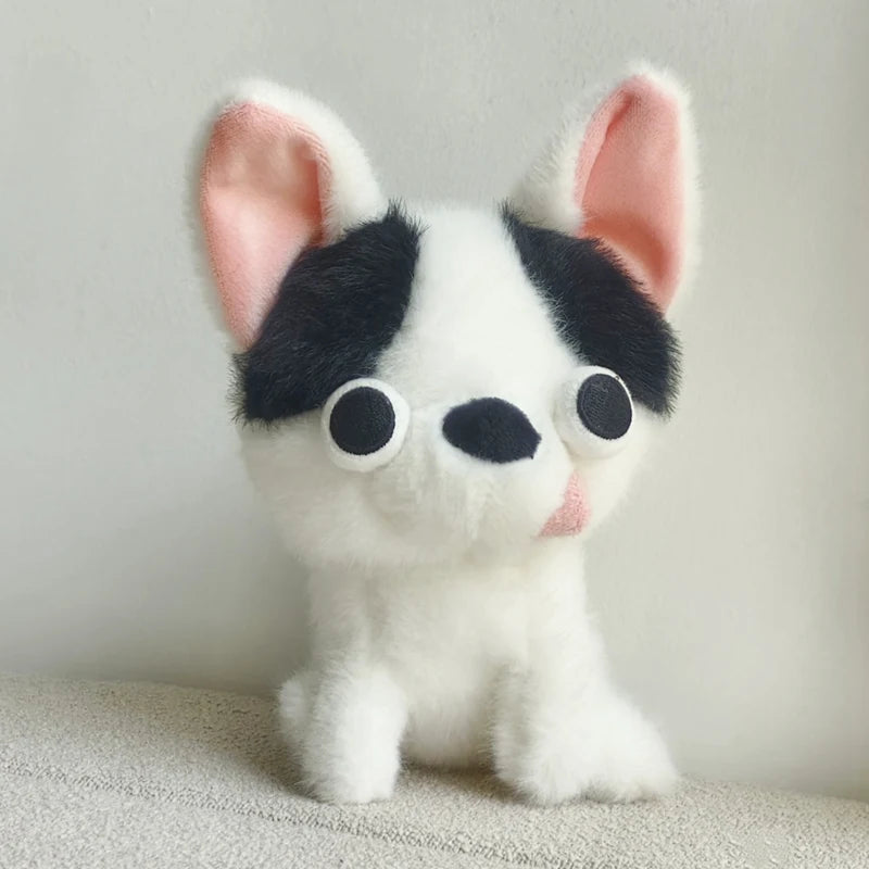 Black and white Chihuahua plush toy with pink inner ears and round embroidered eyes