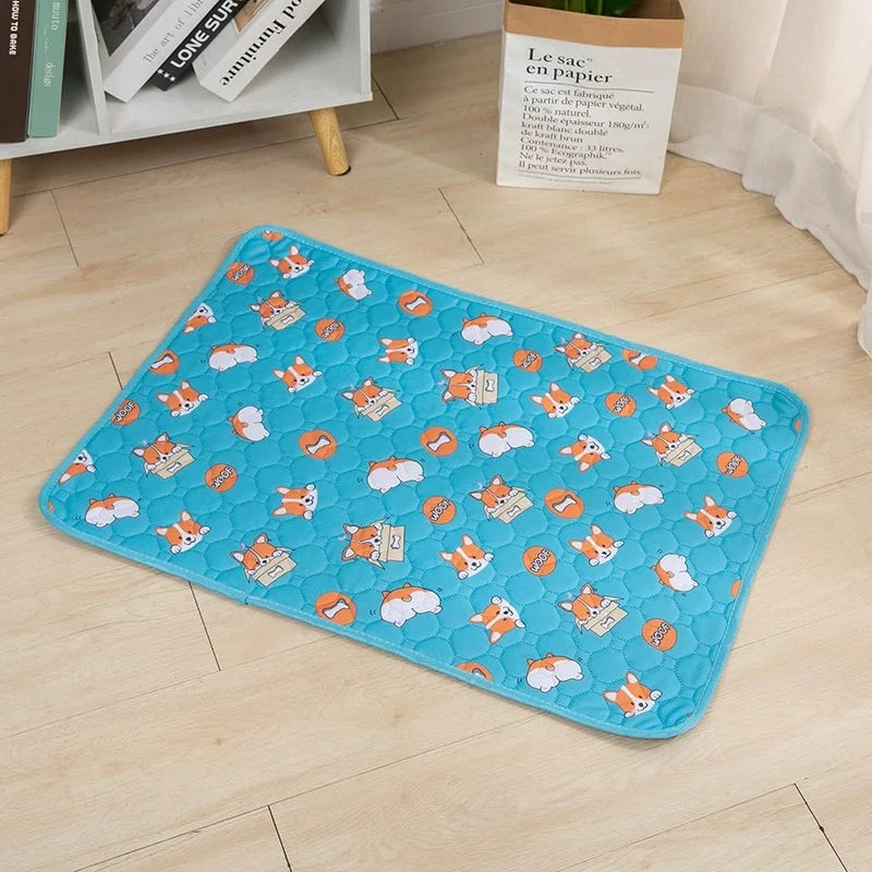 Dog cooling mat with blue corgi pattern laid flat on light wood floor