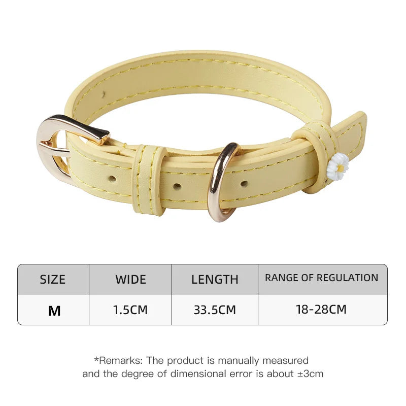 Light yellow PU leather pet collar with metal buckle, daisy charm, and D-ring.