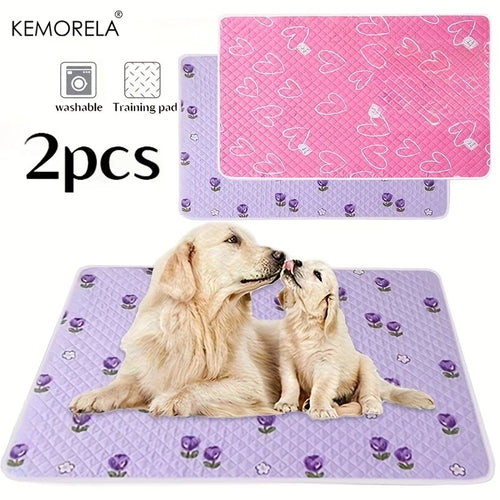 Two-piece pet training mat set, pink and lavender quilted pads with paw and heart prints.