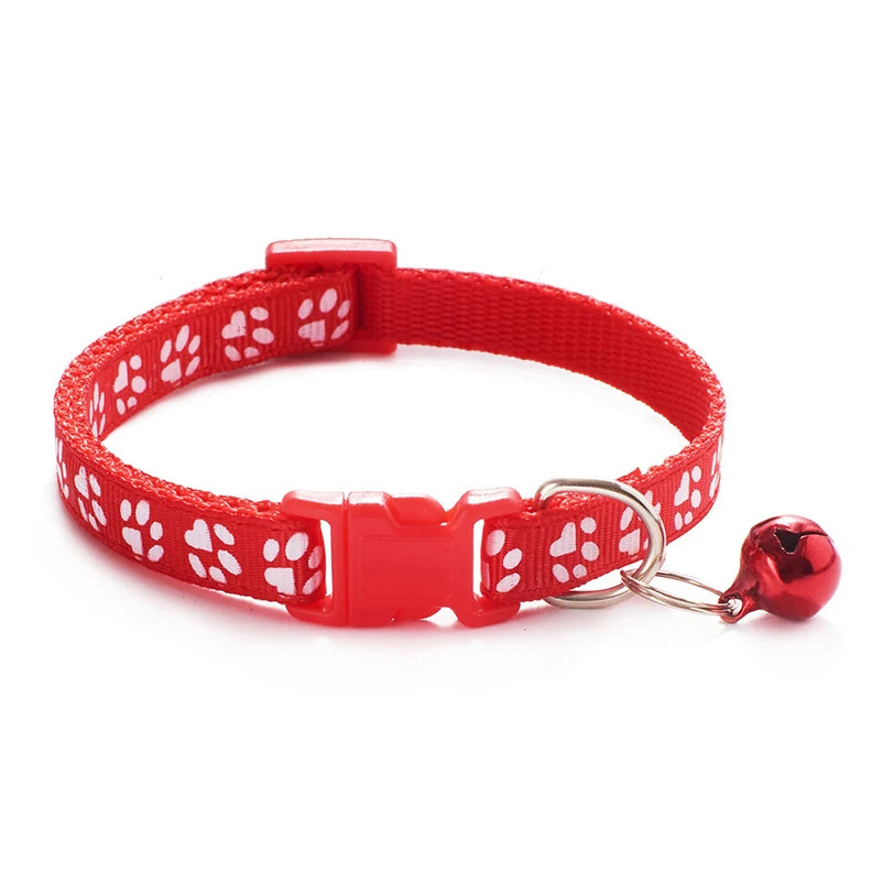 Red paw-print cat collar with buckle and round red bell