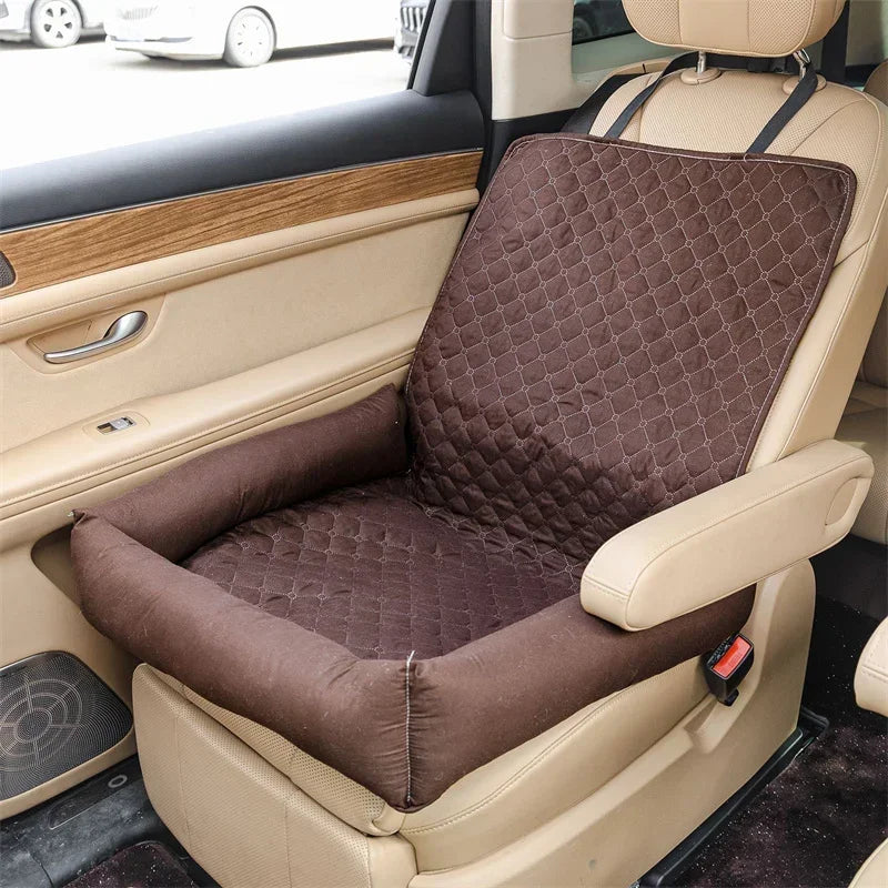 Pet car seat bed cover in brown quilt pattern with padded cushion on a car seat.