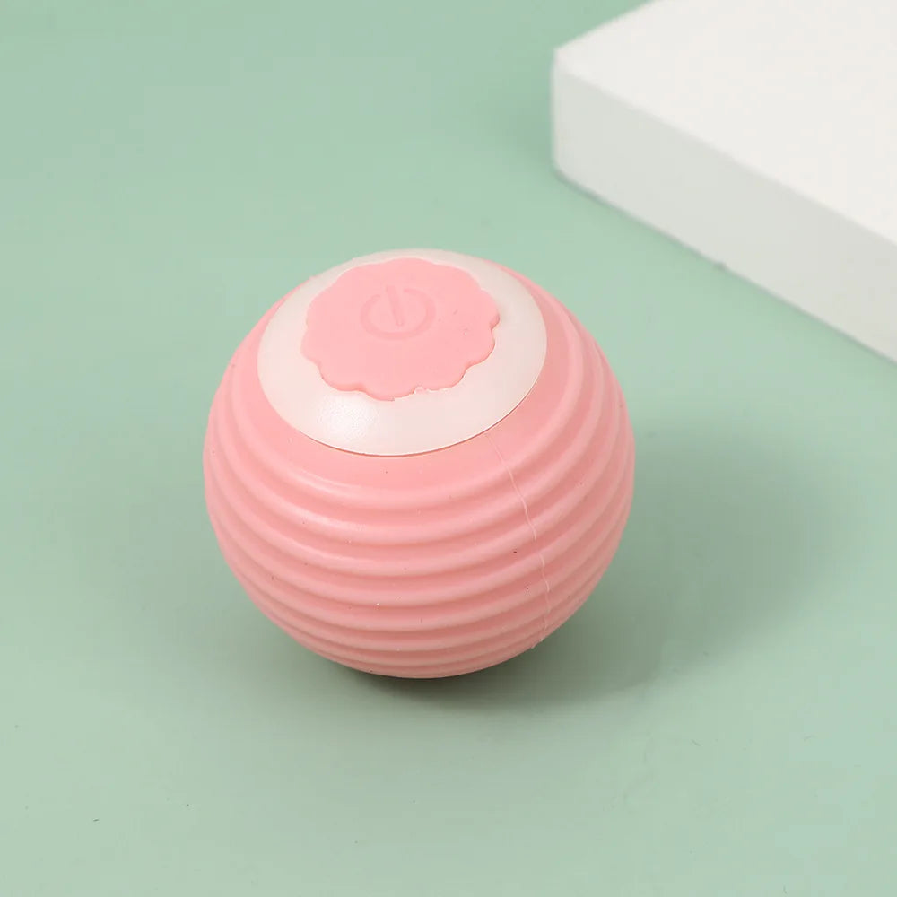 Pink rolling cat toy ball with paw power button
