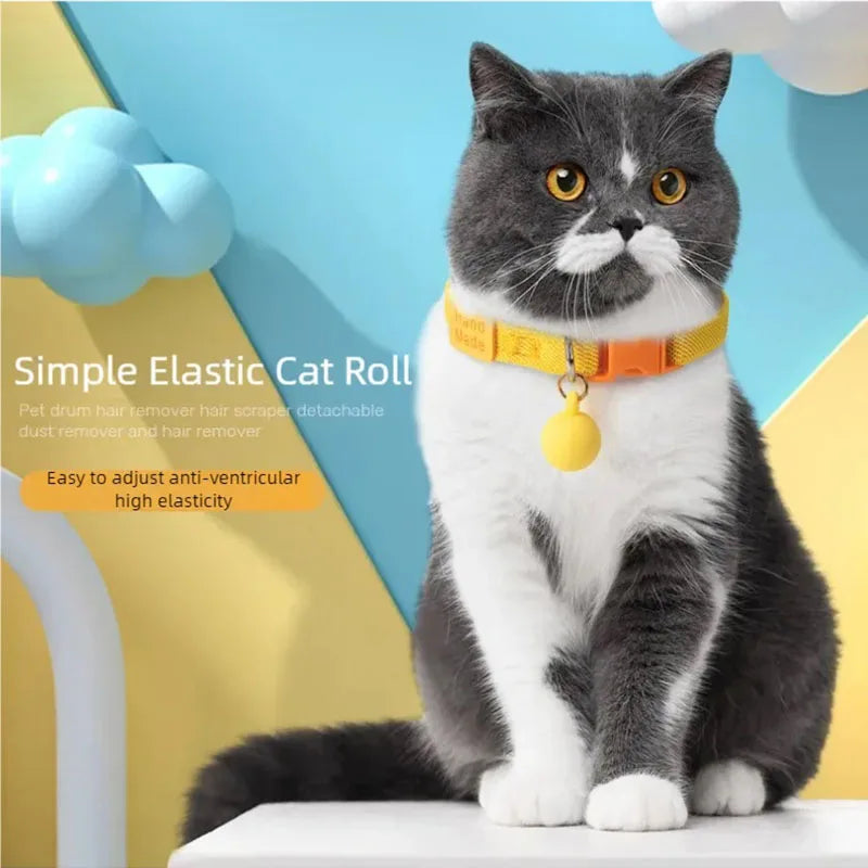 Elastic adjustable cat collar, yellow with small bell charm, on a gray-and-white cat